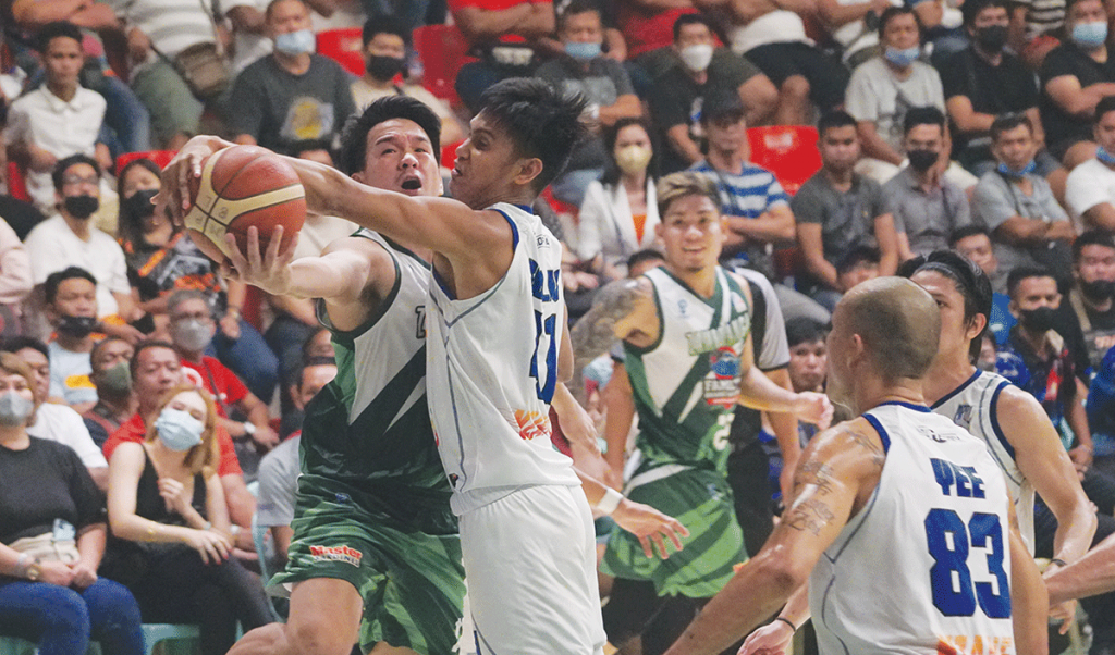 Bacolod BingoPlus’ JayBoy Solis blocks the shot attempt of Zamboanga City Family Brand Sardines’ Jerald Bautista. (MPBL photo)