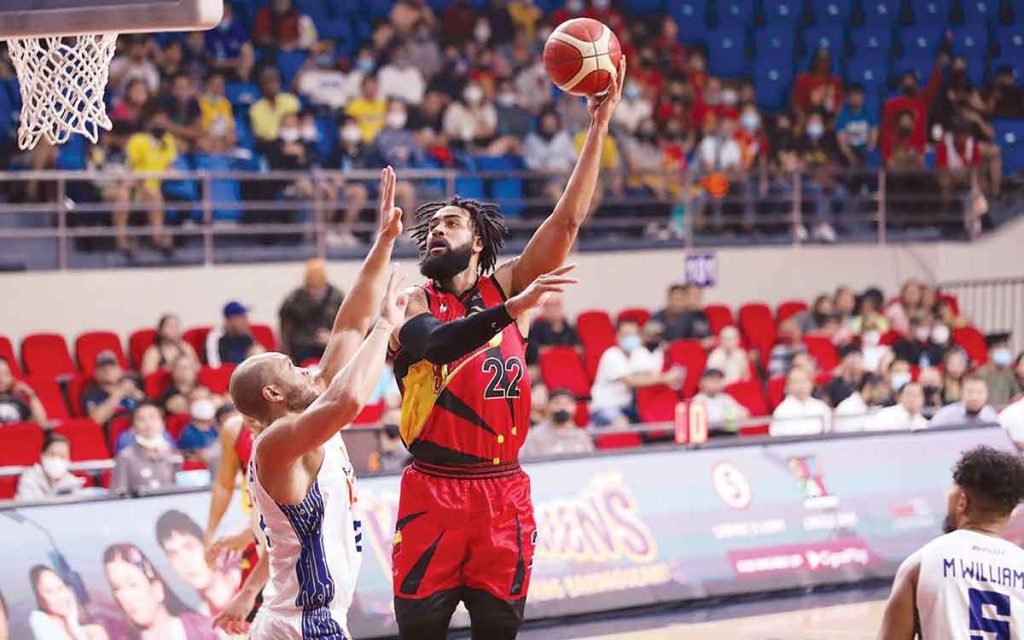 San Miguel Beermen’s Devon Scott attempts a hook shot against the defense of TNT Tropang Giga’s Kelly Williams. (PBA photo)