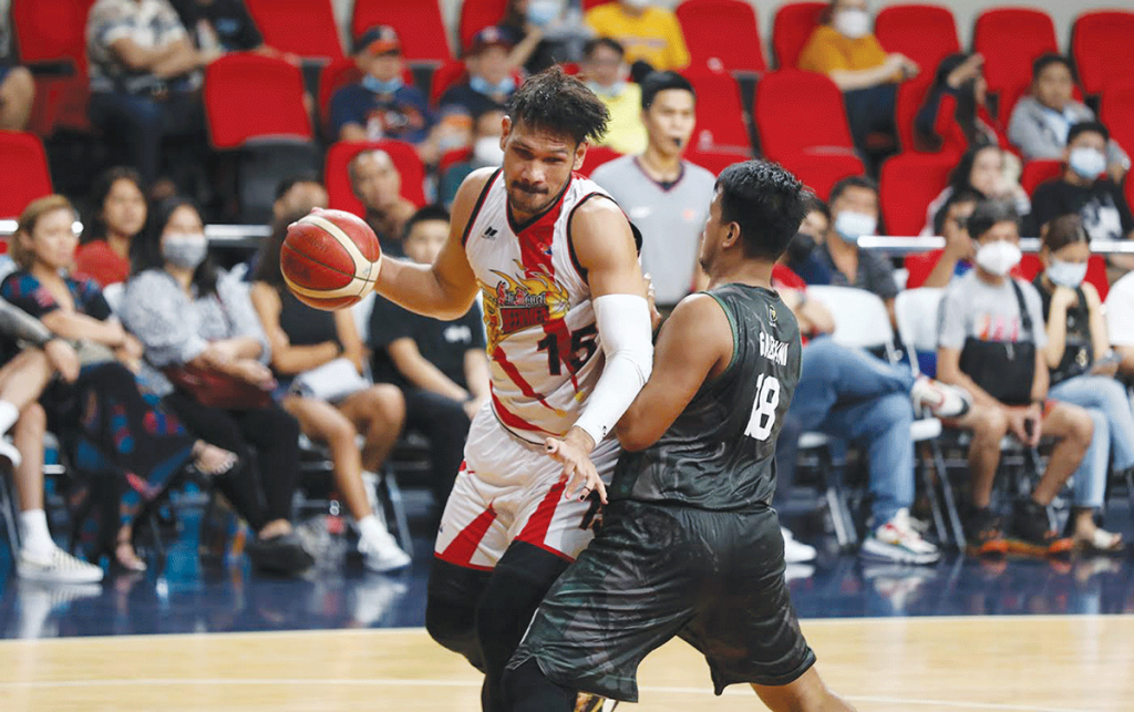 San Miguel Beermen’s June Mar Fajardo tries to ward off the defense of Terrafirma Dyip center Joseph Gabayni. (PBA Media Bureau photo)