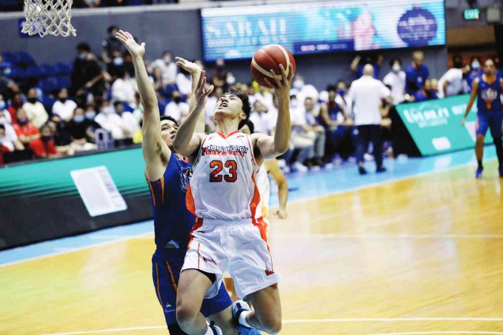 NorthPort Batang Pier's William Navarro scores against the defense of NLEX Road Warriors' Kevin Alas. (PBA photo)NorthPort Batang Pier's William Navarro scores against the defense of NLEX Road Warriors' Kevin Alas. (PBA photo)