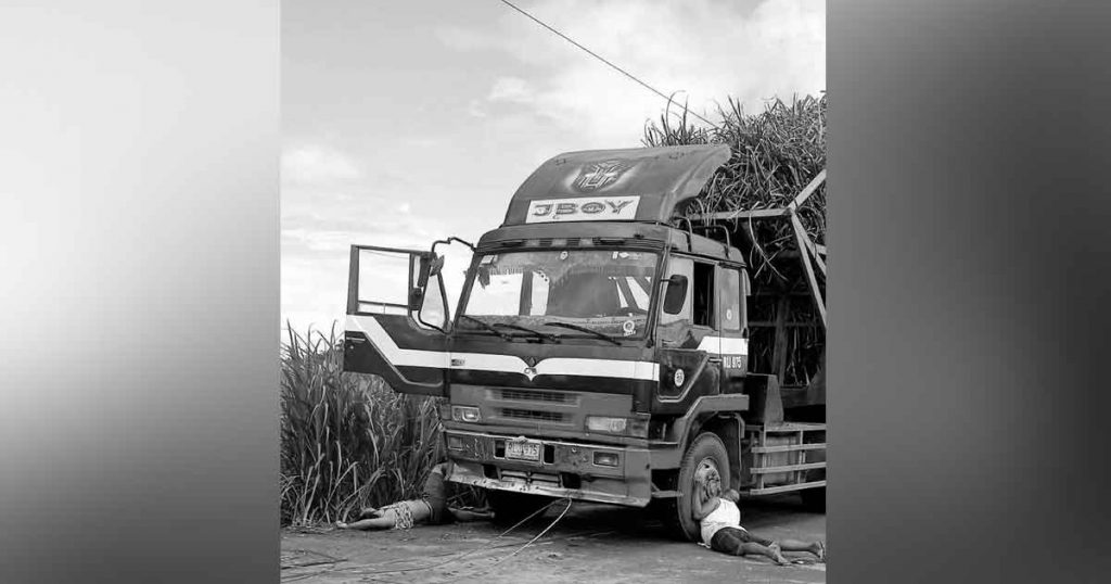 A cane truck driver and his assistant went out of the truck to check the line but they were electrocuted. (Cadiz City PNP photo)