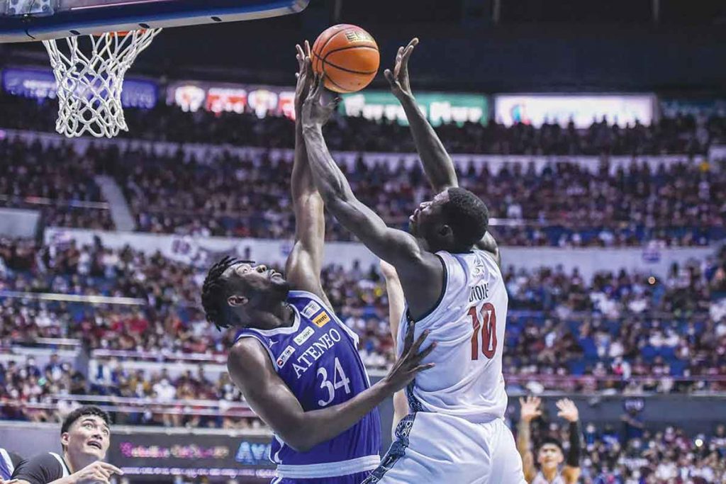 Ateneo de Manila University Blue Eagles’ Angelo Kouame blocks the shot attempt of University of the Philippines Fighting Maroons’ Maodo Malick Diouf. (UAAP photo)