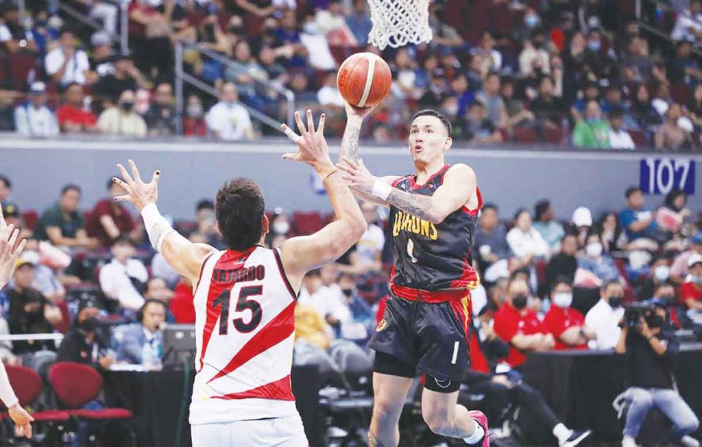 Bay Area Dragons’ Zhu Songwei attempts a floater against the defense of San Miguel Beermen center June Mar Fajardo. (PBA photo)