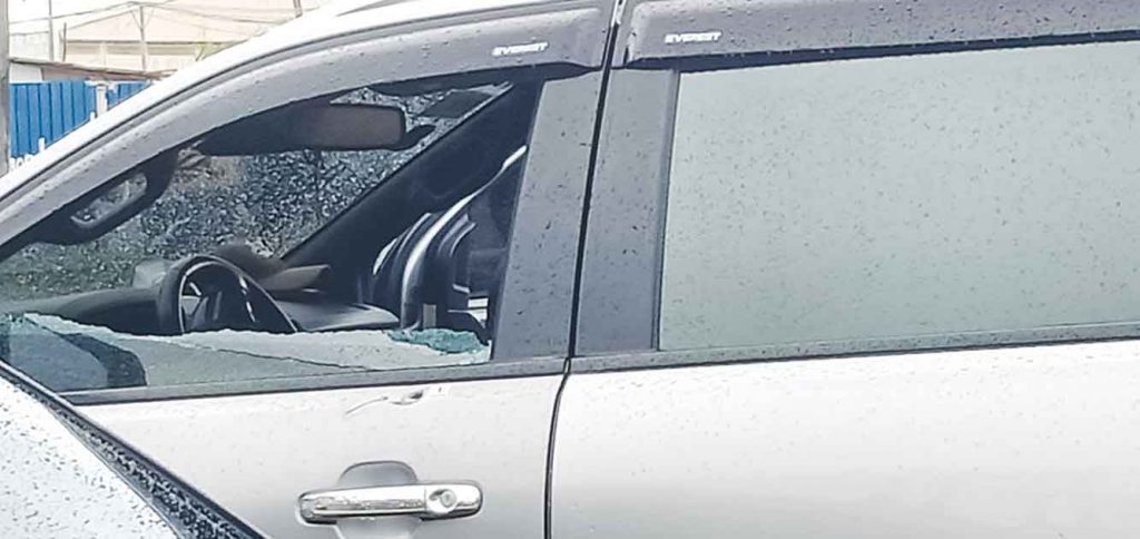 Photo shows the driver's side window of a sports utility vehicle was smashed in an assassination attempt by still unidentified gunmen in Bacolod City yesterday. The alleged target managed to escape. (Aksyon Radyo Bacolod/Contributed photos) 