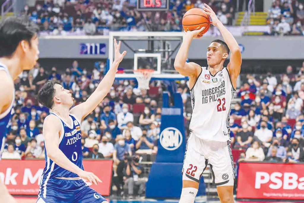 University of the Philippines Fighting Maroons’ Zavier Lucero pulls up for a basket against the defense of Ateneo de Manila University Blue Eagles’ Christopher Koon. (UAAP photo)
