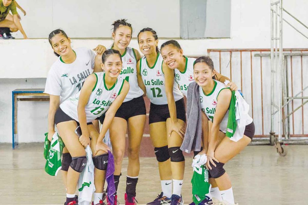 Some members of the University of St. La Salle Lady Stingers posed during a volleyball game. The team will prepare for their upcoming tourney vs. the Abanse Negrense team in an exhibition this Sunday, December 11 at the USLS Gym in Bacolod City. (Photo courtesy of Biki motography)