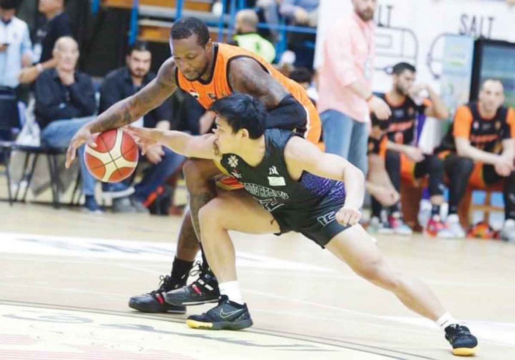 Strong Group-Philippines' JD Cagulangan attempts to steal the ball from an Al Wahda-Syria player. (Photo courtesy of UAE Basketball)