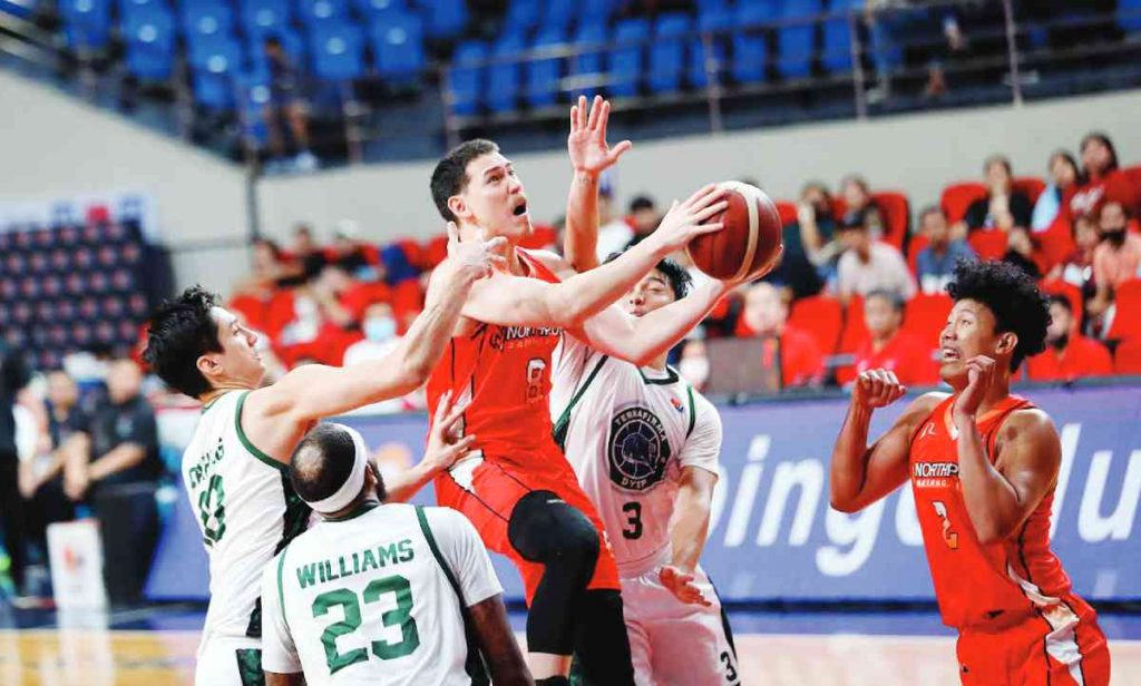 NorthPort Batang Pier’s Robert Bolick, Jr. attacks three Terrafirma Dyip defenders for an inside hit. (PBA photo)NorthPort Batang Pier’s Robert Bolick, Jr. attacks three Terrafirma Dyip defenders for an inside hit. (PBA photo)