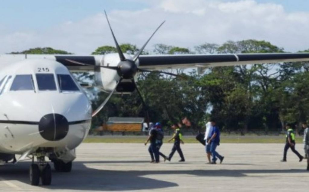 Three suspects arrested for alleged illegal possession of firearms and ammunition over the weekend boarded a military aircraft at Dumaguete-Sibulan Airport in Negros Oriental’s Dumaguete City yesterday afternoon, March 26, 2023. Raids were conducted on March 24 and 25 at a sugar mill compound in Sta. Catalina town, where high-powered and short firearms, explosives, thousands of ammunition, and more than P 18 million in cash were found. (PNA photo)