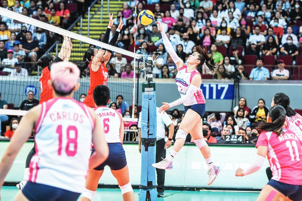 Creamline Cool Smashers’ Michele Gumabao tries to drop the ball against the defense of Negrense Jonah Sabete of Petro Gazz Angels. (PVL photo)