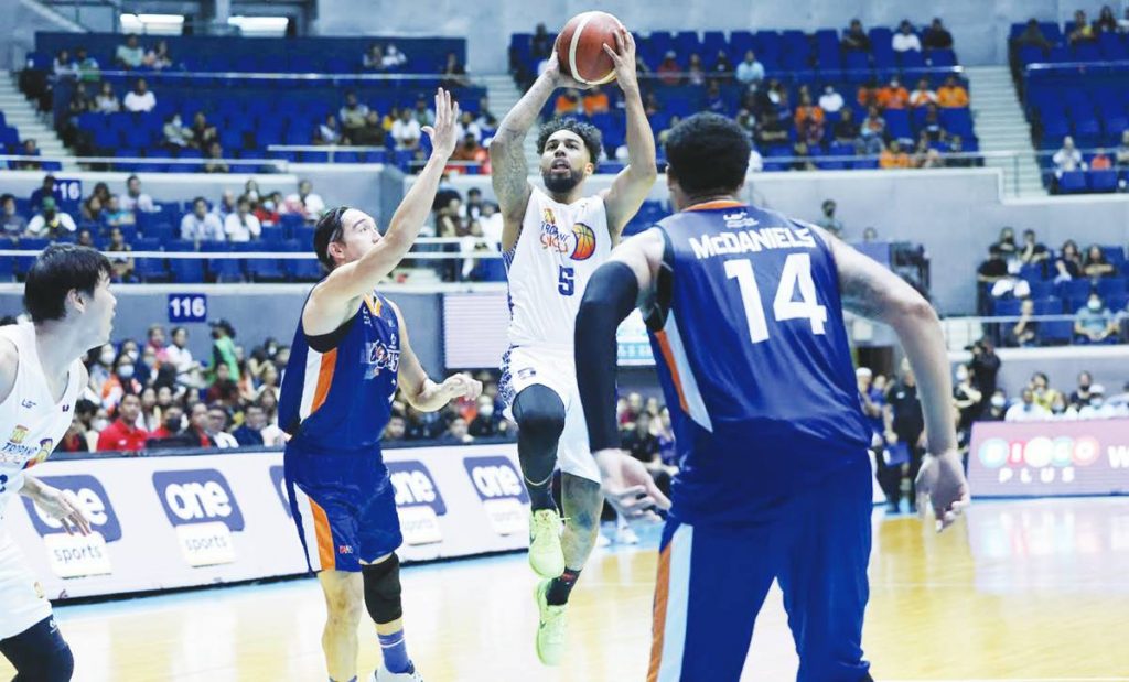 TNT Tropang Giga’s Mikey Williams attacks the defense of Meralco Bolts' Clifford Hodge for an inside hit. (PBA photo)