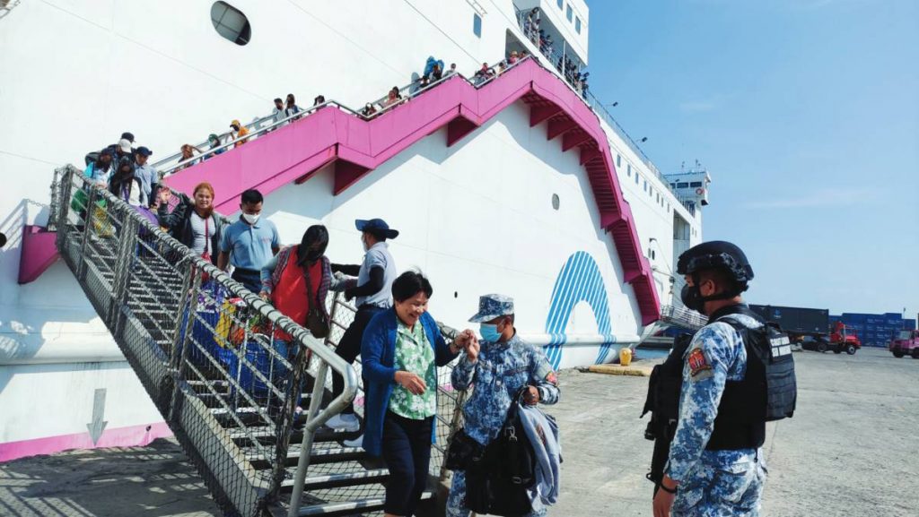 Personnel from the Philippine Coast Guard assist in the disembarkation of more or less 400 passengers who traveled this Holy Week from Manila North Harbor Port arriving in Bacolod City’s BREDCO Port, yesterday, April 5, 2023. (PCG photo)