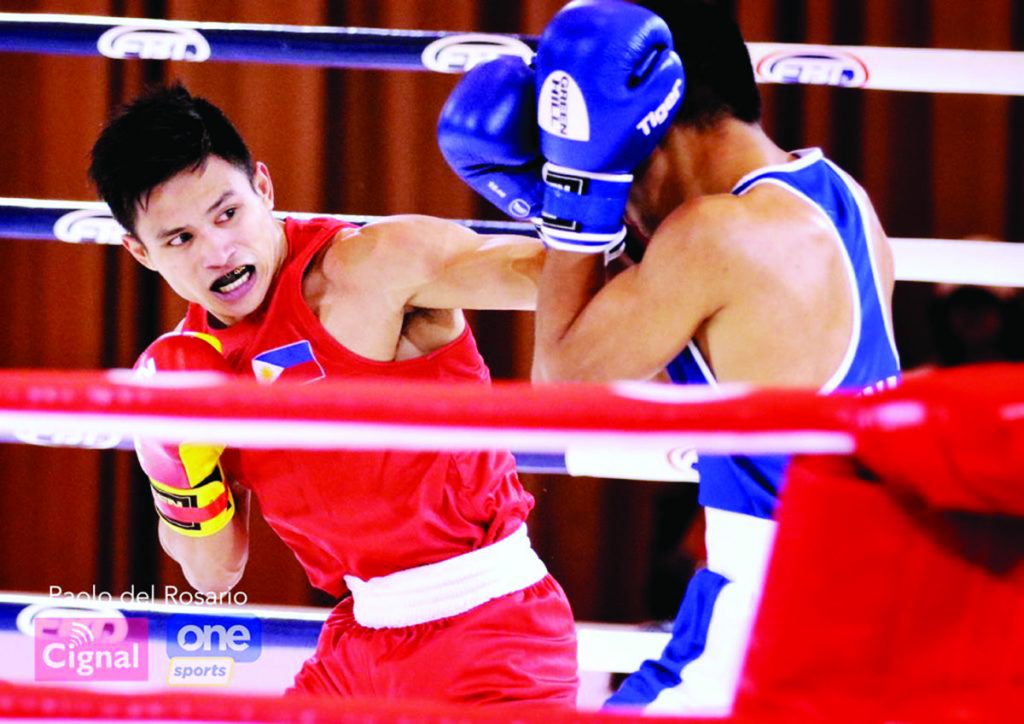 Negrense boxer Ian Clark Bautista lands a punch against Indonesian Asri Udin. (Photo courtesy of Paolo del Rosario/Cignal One Sports)