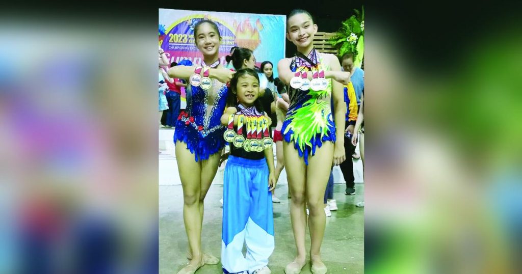 Bacolod Tay Tung High School gymnasts Jilian Krishna dela Cruz, Reaiah Patricia Tan and Matthea Given Efenio displayed their 2023 WVRAA Meet medals. (Photo courtesy of Jose Montalbo)