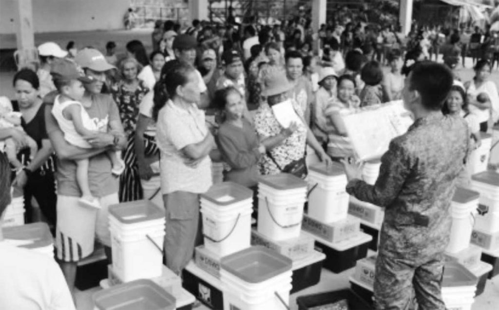 Residents of Barangay Paitan in Negros Occidental’s Escalante City, affected by a recent encounter between New People’s Army rebels and government troops, receive survival kits on Tuesday, May 2, 2023. (Photo courtesy of 79th Infantry Battalion / Philippine Army)