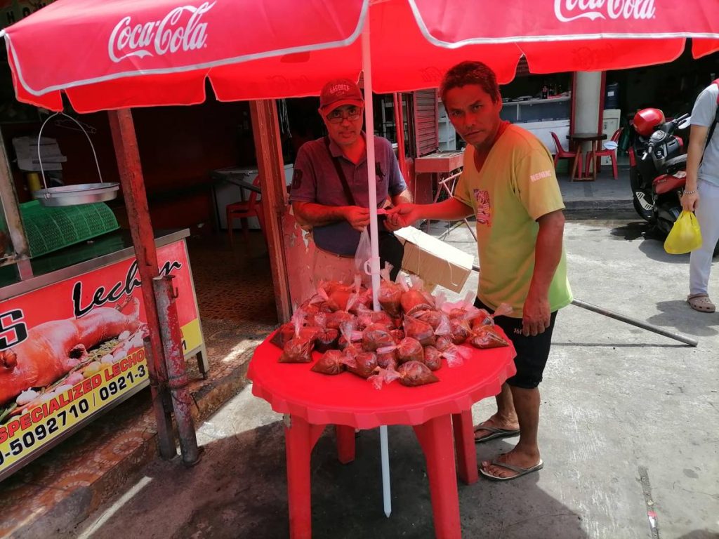 Lechon vendors in Bacolod City assure customers that the popular pork delicacy is still safe for consumption despite the threat of African swine fever. (Dominique Gabriel G. Bañaga photo)