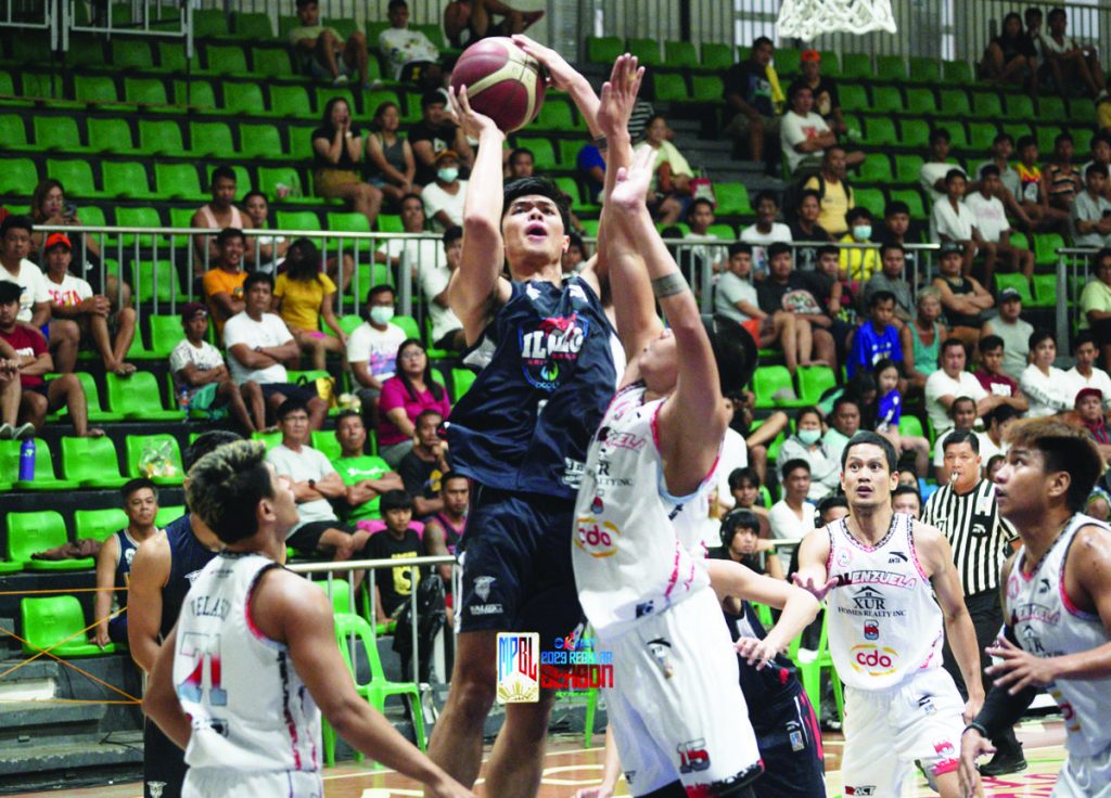 Iloilo United Royals-Cocolife’s Conrad Catapusan was forced to take a tough shot by the defense of Valenzuela XUR Homes Realty Inc. (MPBL photo)