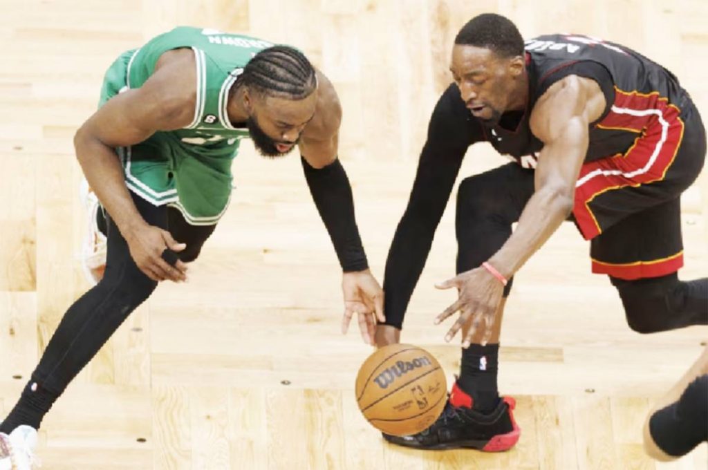 Boston Celtics guard Jaylen Brown (left) and Miami Heat center Bam Adebayo reach for the loose ball during the second quarter of Game 7 of the Eastern Conference Finals at the TD Garden in Boston, Massachusetts on May 29, 2023. (CJ Gunther / EPA-EFE photo)