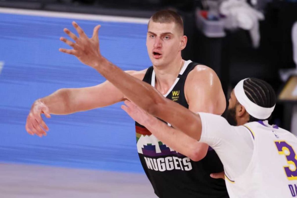 Denver Nuggets center Nikola Jokic (left) makes a pass as Los Angeles Lakers forward Anthony Davis defends during the second half of Game 3 of the NBA Western Conference Finals at the ESPN Wide World of Sports Complex in Kissimmee, Florida in 2020. (Erik Lesser/EPA-EFE/File photo)