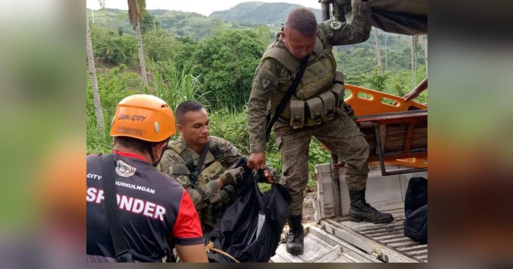 Troops of the 62nd Infantry Battalion unloaded one of the fatalities following an encounter at Barangay Trinidad in Negros Oriental’s Guihulngan City on Sunday, May 21, 2023. (62IB photo)