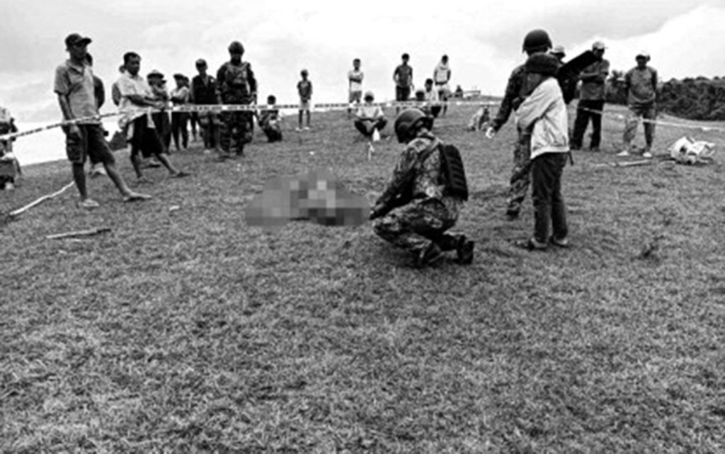 Police process the crime scene where a farmer was shot dead by New People's Army members in Negros Oriental’s Guihulngan City on Saturday afternoon, May 20, 2023. The victim reportedly refused to continue to support the group. (Photo courtesy of Guihulngan City Police)