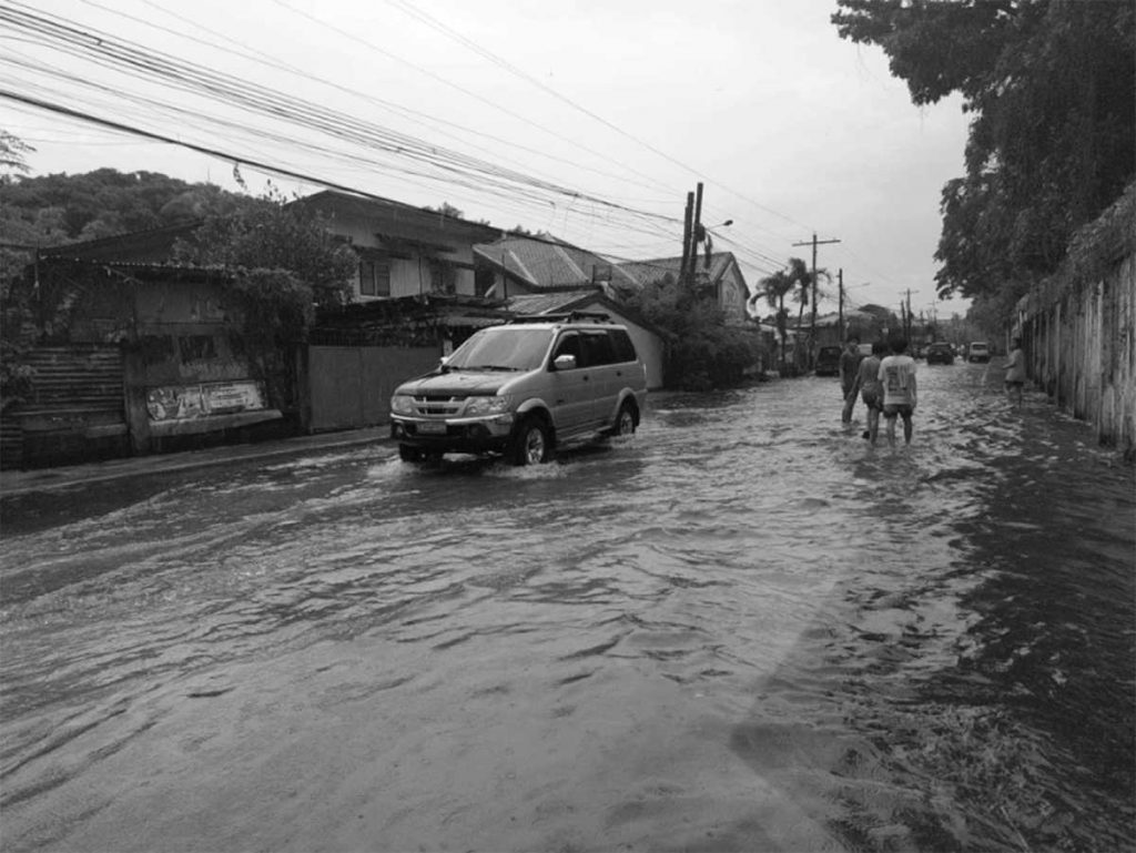 Photo shows a flooded street in Bacolod City’s barangays 3 and 4 on Friday, May 5, 2023. Classes and work were also suspended in some local government units in Negros Occidental last week due to a low pressure area. (Aksyon Radyo Bacolod photo)