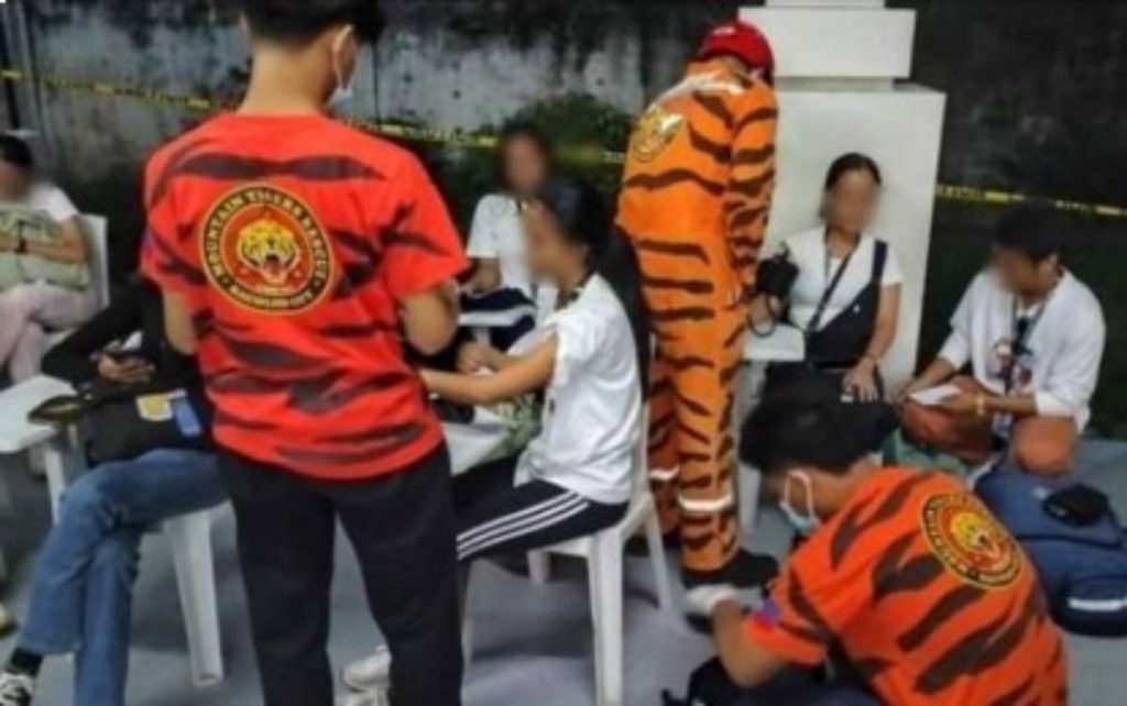 Emergency medical responders monitor the vital signs of students of Bacolod City College who fell ill after inhaling colored smoke during a Physical Education performance task on Monday afternoon, May 29, 2023. At least 20 students were given first aid treatment, of which seven were brought to medical facilities, but were already in stable condition yesterday, May 30. (Photo courtesy of Mountain Tigers Search and Rescue Bacolod)  