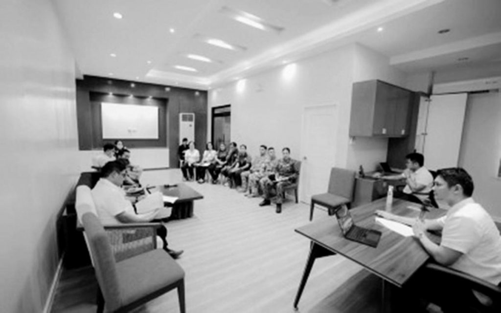 Victorias City Mayor Javier Miguel Benitez (right) presides over an emergency meeting on Monday, May 22, 2023, to discuss the actions taken by the city government on the molasses spill involving the sugar refinery Victorias Milling Company in northern Negros Occidental. The city council set up a legislative inquiry regarding the incident on Wednesday, May 24. (Victorias City Information Office photo)