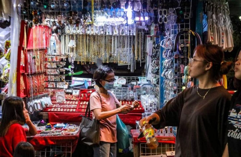 A woman buys watch straps from an accessories store at the Marikina City Public Market on June 1, 2023. Consumers attributed the continued pessimism to the faster increase in the prices of goods and higher household expenses, lower income and fewer jobs, the Bangko Sentral ng Pilipinas says. (Jonathan Cellona / ABS-CBN News photo)