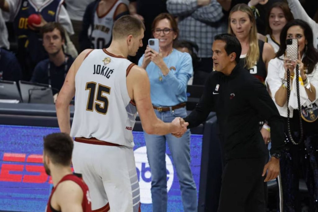 Denver Nuggets center Nikola Jokic of Serbia (left) shakes hands with Miami Heat head coach Erik Spoelstra following the Nuggets' win in Game 5 of the NBA finals at the Ball Arena in Denver, Colorado. (John Mabanglo / EPA-EFE photo)