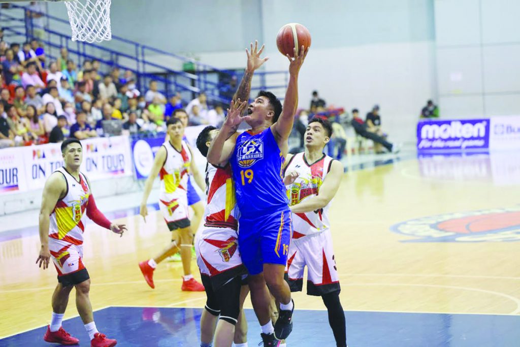 NLEX Road Warriors’ Dominick Fajardo attacks a San Miguel Beermen defender for a layup. (PBA photo)