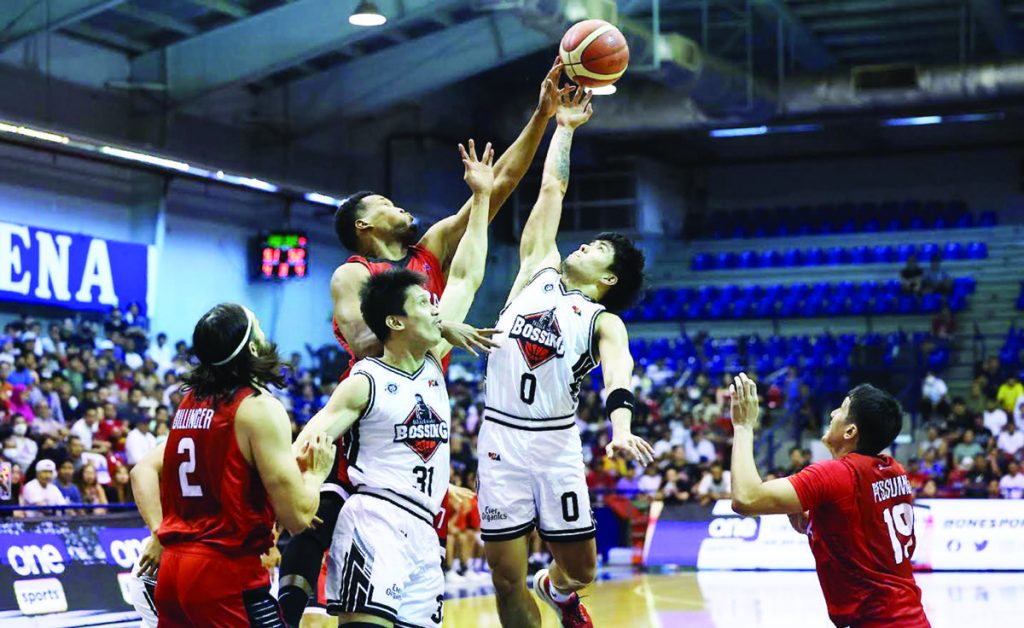 Barangay Ginebra San Miguel Kings’ Sidney Onwubere blocks the shot of Blackwater Bossing’s RK Ilagan. (PBA photo)