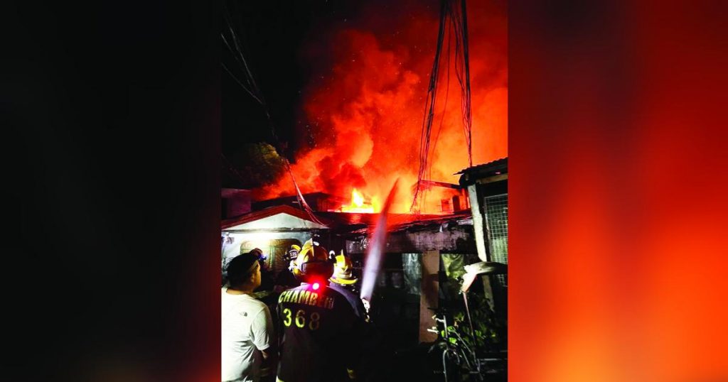 Firefighters extinguish the blaze at Purok Magnolia in Bacolod City's Barangay 7 on Thursday night, July 6, 2023, which spread easily as most of the houses were made of light materials. (Chamber Volunteer Fire Brigade photo)