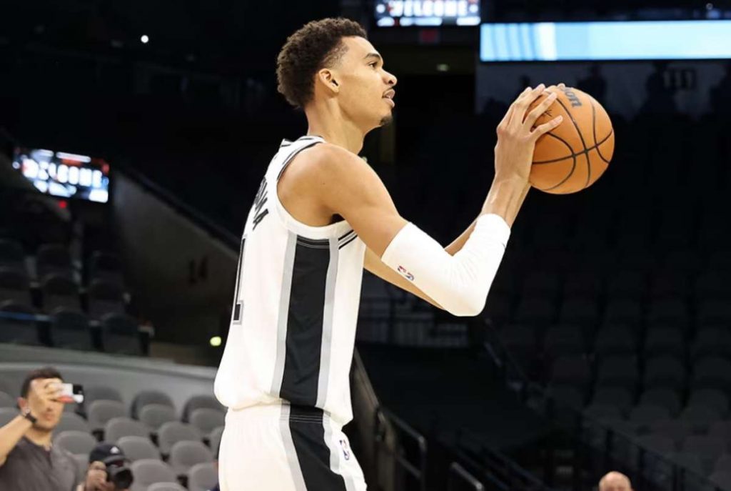 San Antonio Spurs first round pick Victor Wembanyama of France gives fans a first look dressed in a Spurs uniform during a shoot around at the press conference at the AT&T Center in San Antonio, Texas on June 24, 2023. (Adam Davis / EPA-EFE / File photo)