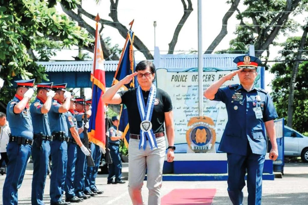 Interior Secretary Benjamin Abalos, Jr. (center) is joined by Central Visayas police director, Brigadier General Anthony Aberin as they arrive at the Negros Oriental Police Provincial Office headquarters in Sibulan town on Saturday, July 8, 2023. Abalos urges provincial government officials and local police to maintain peace and order in the province. (Negros Oriental Police Provincial Office / Facebook photo)