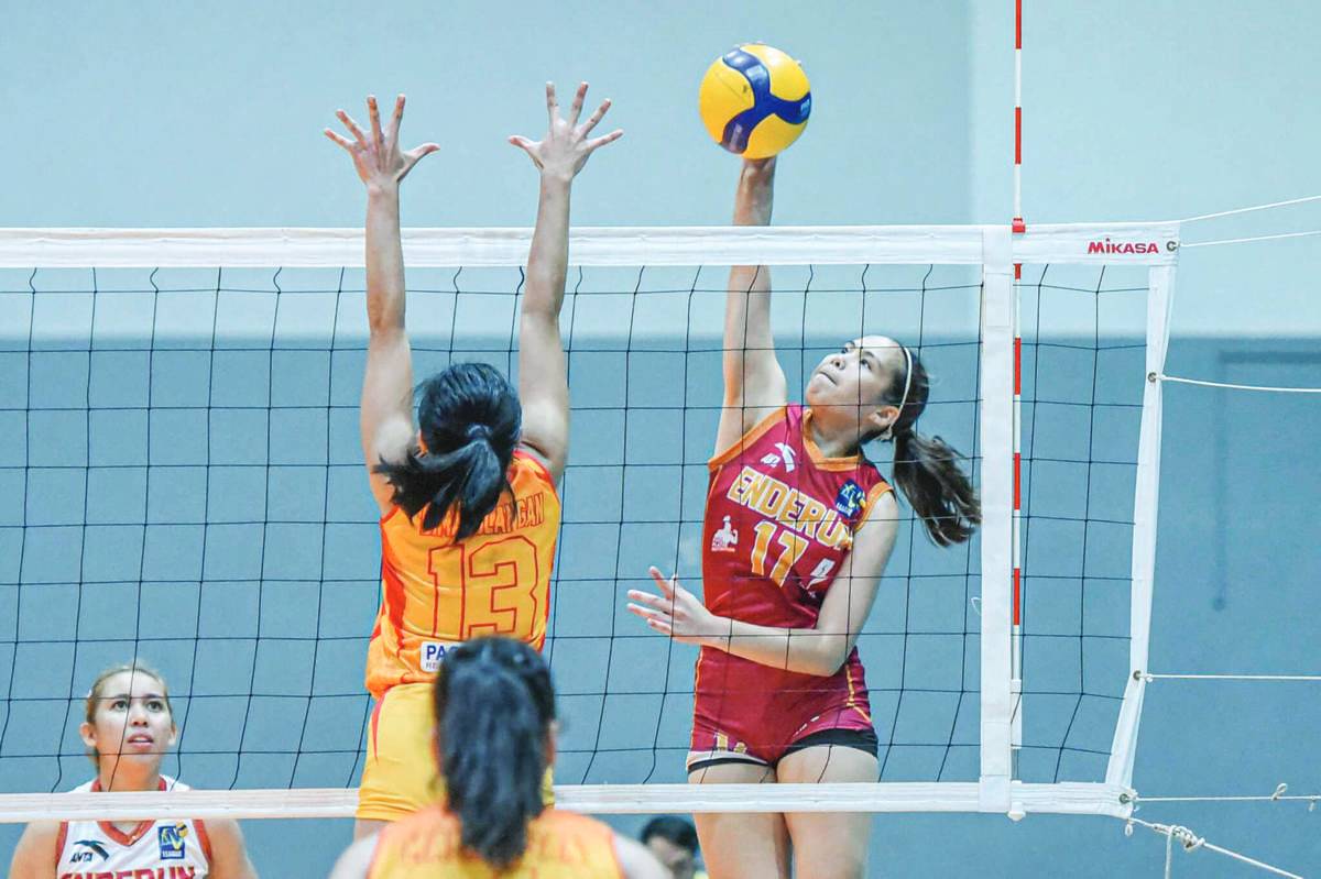 Negrense Erika Deloria of Enderun College Lady Titans attempts to score against a San Sebastian College Lady Stags defender. (V-League photo)