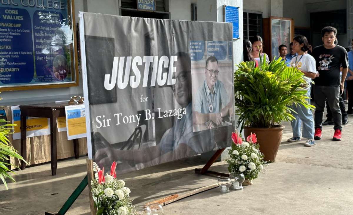 Faculty members and students of the Binalbagan Catholic College offer a prayer vigil for Tony Lazaga, who was found dead in front of his boarding house at Barangay San Pedro in Negros Occidental’s Binalbagan town yesterday, August 16, 2023. (The Patrician / Facebook photo)