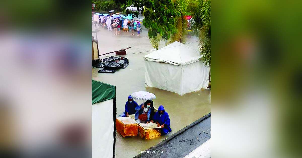 Torrential rains and floodwaters displaced around 8,000 residents of Bago City, Negros Occidental. Photo shows the rising floodwaters also affecting the Bago City Hospital yesterday, August 29. Photo courtesy of Bago City Hospital