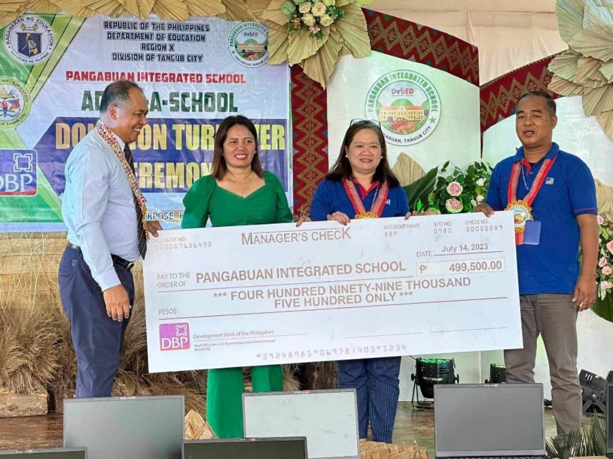 Shown in photo during the Donation Turnover Ceremony in Pangabuan Integrated School are (from left) DBP Senior Assistant Vice President Romel S. Calapardo, Pangabuan Integrated School Principal Richel B. Ongcol together with representatives from DBP Ozamis Branch Manager Arcelyn C. Abao, and Mr. Baltazar C. Porol.