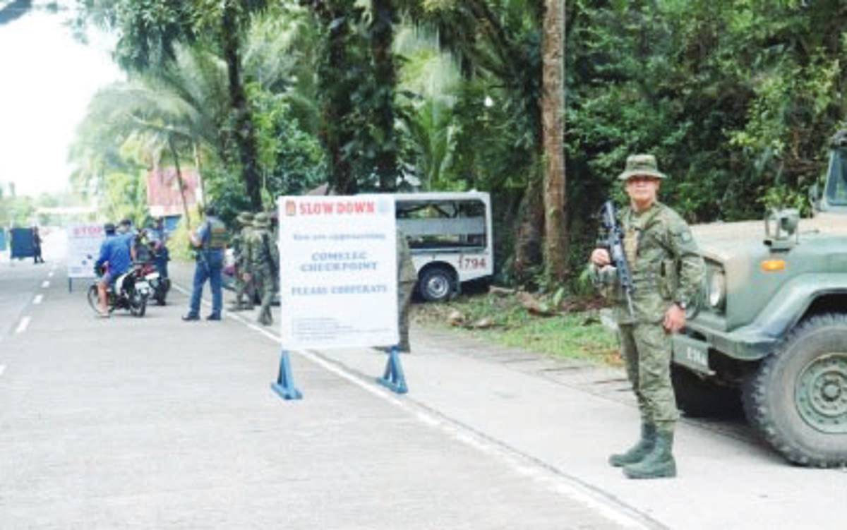 Security forces man a checkpoint in Negros Oriental. The Regional Joint Security Control Center-Central Visayas will reassess the security situation in Negros Oriental to determine if there is a need to deploy more troops, as the Commission on Elections en banc ruled to push through with the Barangay and Sangguniang Kabataan Elections in the violence-hit province on October 30, 2023. (Viscom PIO photo)