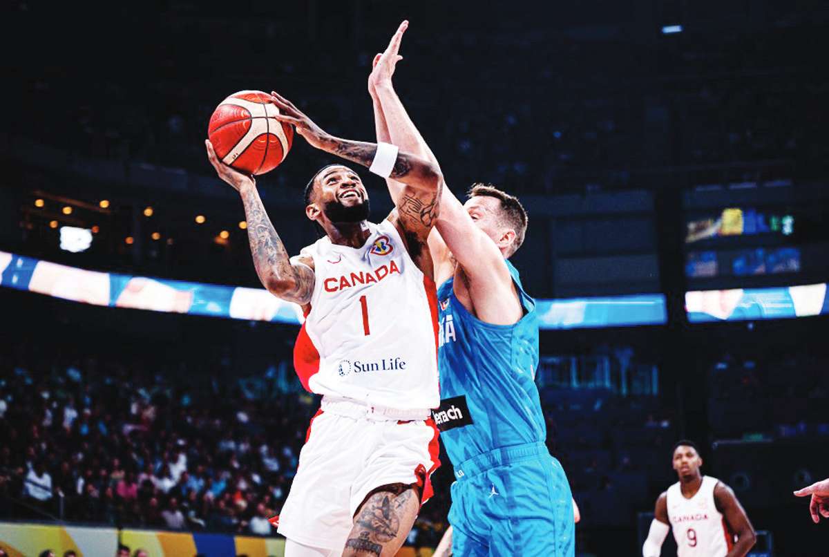 Canada’s Nickeil Alexander-Walker aggressively attacks Slovenia’s defense for an inside hit. (FIBA photo)