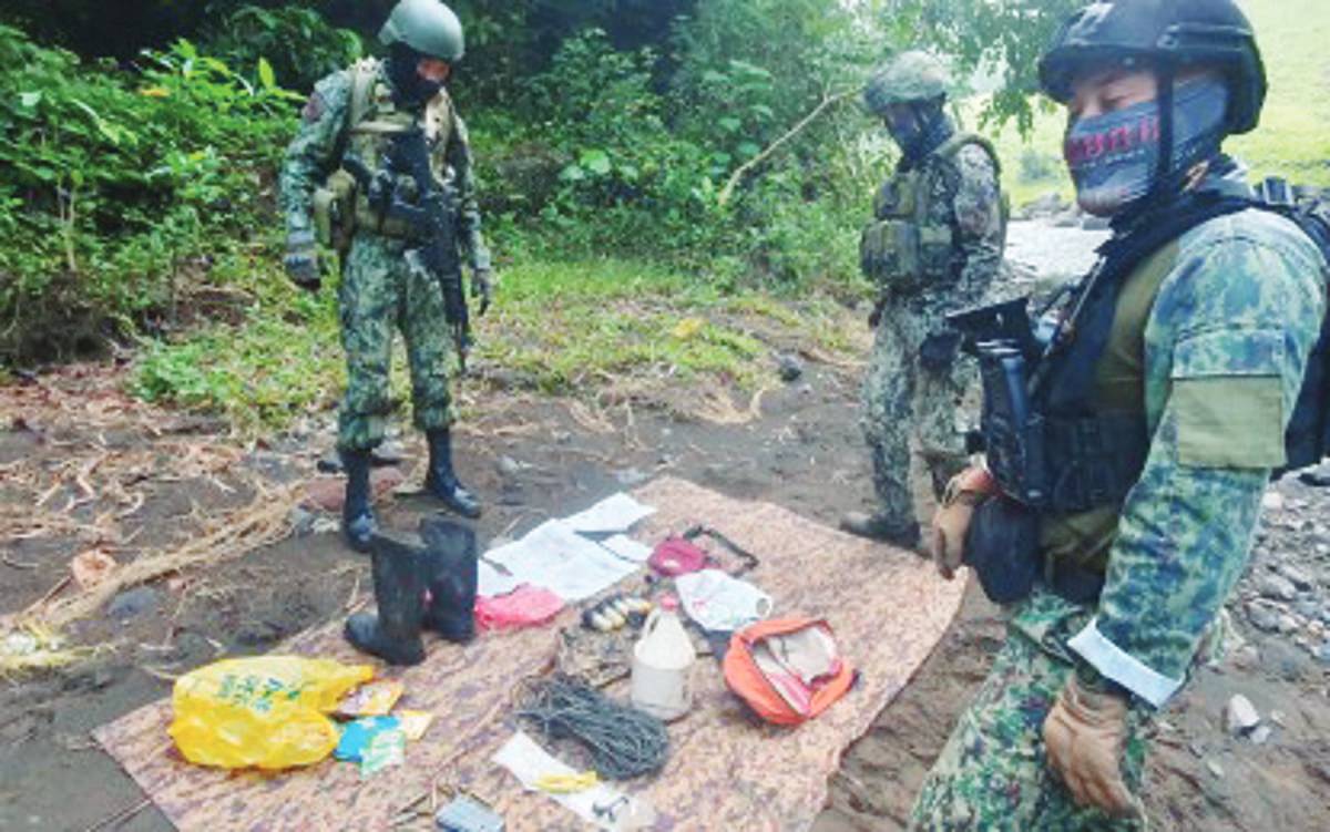 Police operatives recovered several rounds of ammunition and what appeared to be bomb components on Tuesday, October 17, 2023, at a cave in Negros Oriental’s Mabinay town. The cave is believed to be a temporary harbor area of alleged Communist New People's Army members, the Negros Oriental Police Provincial Office said. (NOPPO photo)