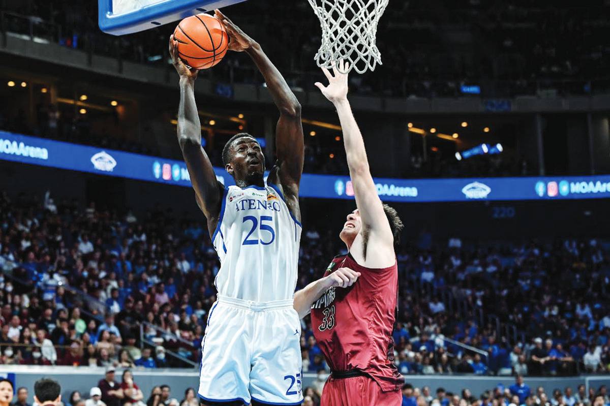 Ateneo de Manila University Blue Eagles’ Joseph Obasa attempts to score against University of the Philippines Fighting Maroons’ Sean Alter. (UAAP photo)