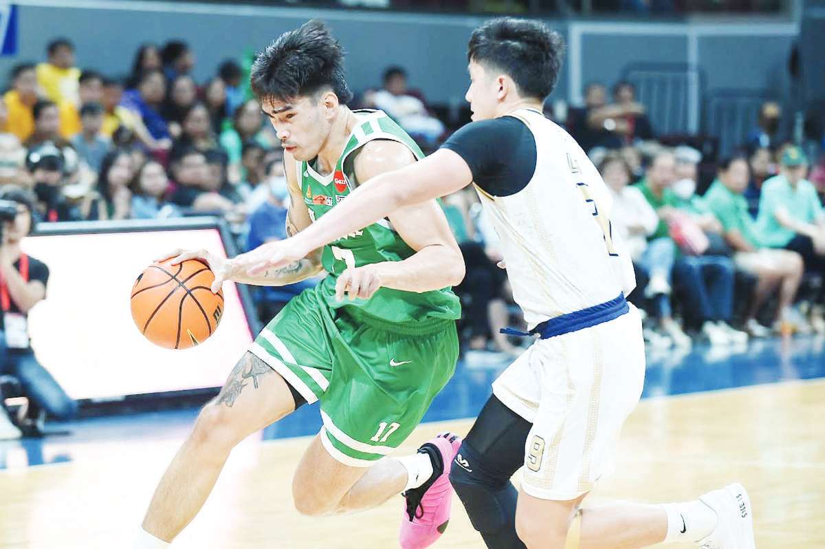 De La Salle University Green Archers’ Kevin Quiambao wards off the defense of Bacolodnon Donn Lim of the National University Bulldogs. (UAAP photo)