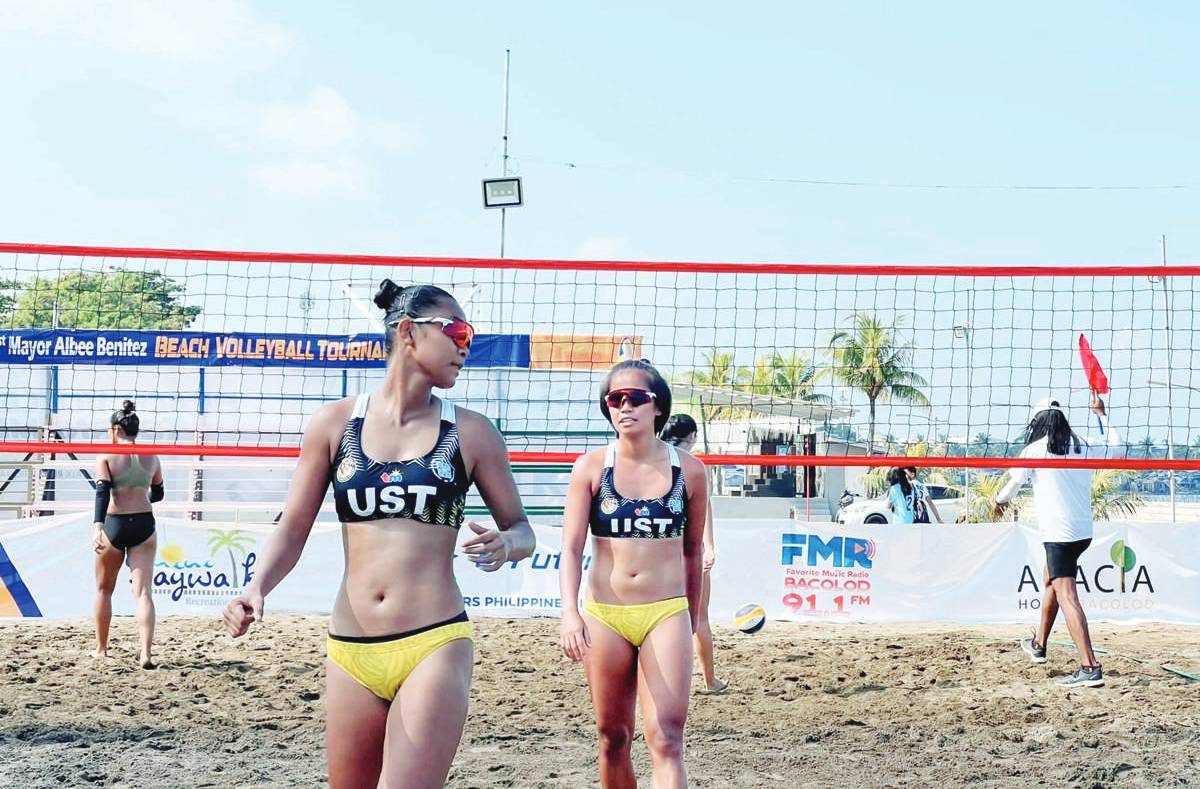 University of Santo Tomas Golden Tigresses’ Genesa Eslapor and Sophia Pagara in action during the 1st Mayor Albee Benitez Beach Volleyball Tournament. (Paul Jan Doloiras photo)