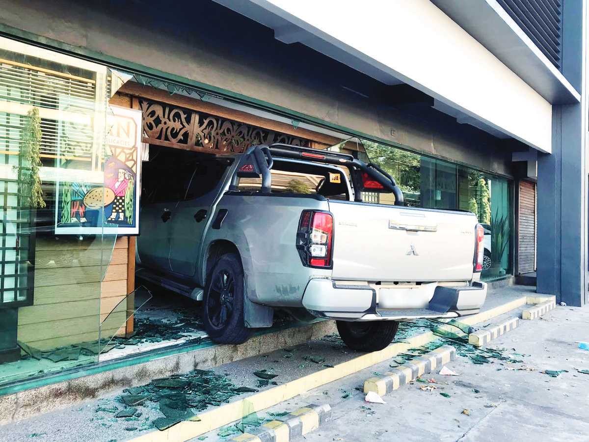 A pick-up truck crashed into a glass wall of a native delicacy store along B.S. Aquino Drive in Bacolod City over the weekend. A police investigation revealed that the driver lost control of the vehicle as he tried to park beside the establishment. (Contributed photo)