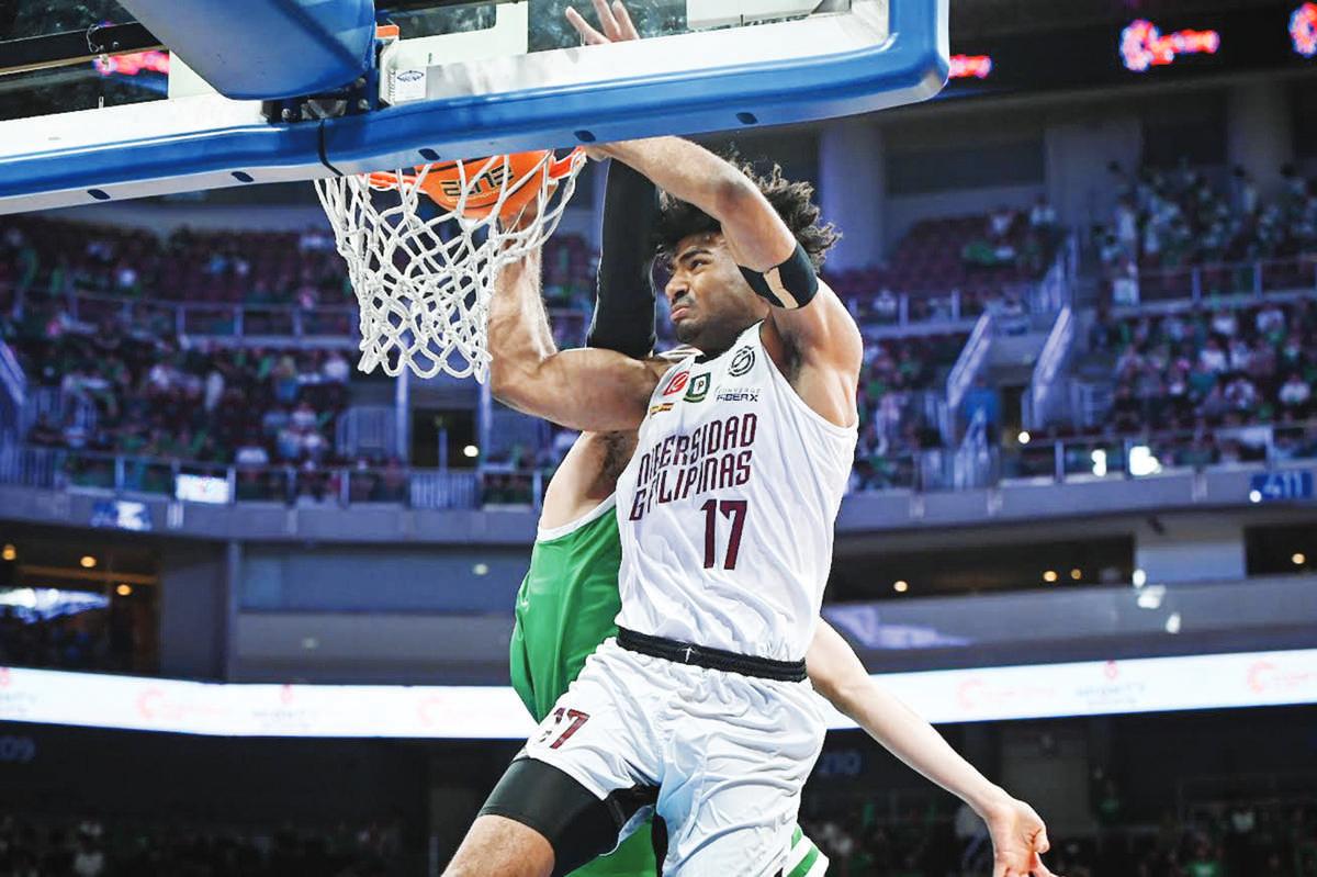 University of the Philippines Fighting Maroons’ Francis Lopez scores on a two-handed dunk. (UAAP photo)