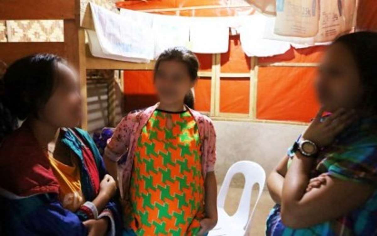 Three former female rebels, “Marilyn” (left) meet with “Sarah” and “Aubre” after the two surrendered on Monday, December 18, 2023, to Army and police in Negros Oriental. All three are members of the New People's Army operating in South Negros Oriental. (11IB photo)