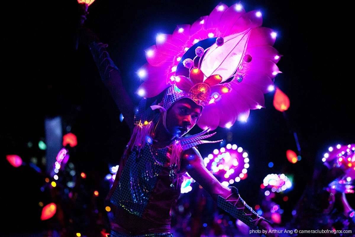 Parade participants, adorned in radiant costumes and illuminated accessories, march alongside floats, creating a mesmerizing spectacle that captures the essence of the festival. (Arthur Ang / cameraclubofnegros.com photo)