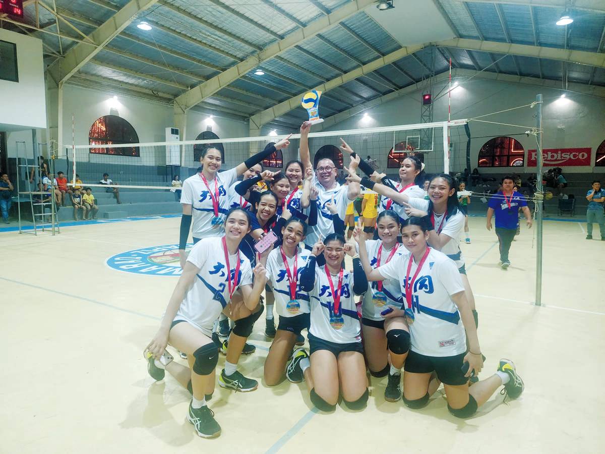 The Bacolod Tay Tung High School Thunderbolts celebrate their victory in the 2023 Rebisco 18-and-Under Volleyball League Western Visayas Qualifiers. (Jose Montalbo photo) 